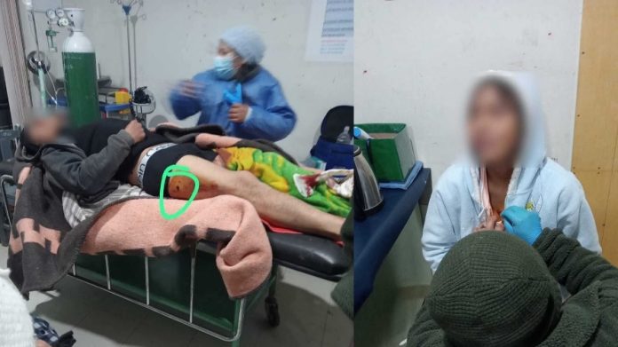 Hospital scene with a patient on a gurney and medical staff attending; a leg wound is circled to show injury.