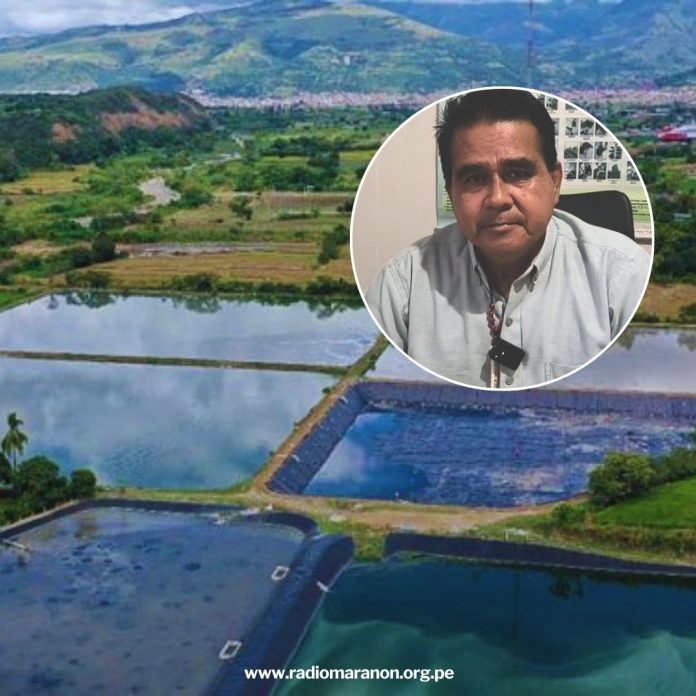 Aerial view of salt ponds and green fields with distant mountains, overlaid with a circular portrait of a man in a light shirt in the upper right corner.