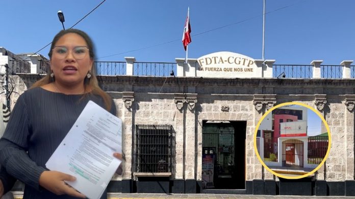 Woman holding papers stands in front of a stone building with a sign reading FDTA-CGT, blue sky above.
